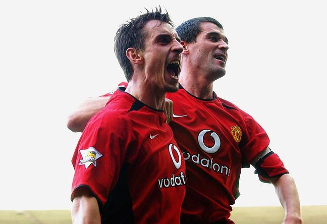 Gary Neville and Roy Keane celebrate a Manchester United goal (Credit: John Peters/Man Utd/Getty)